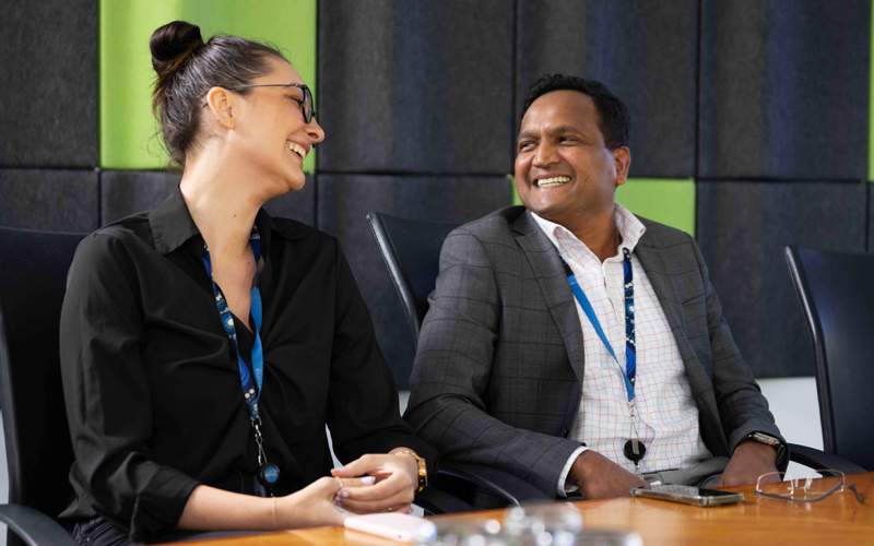 Image of employees in a board room