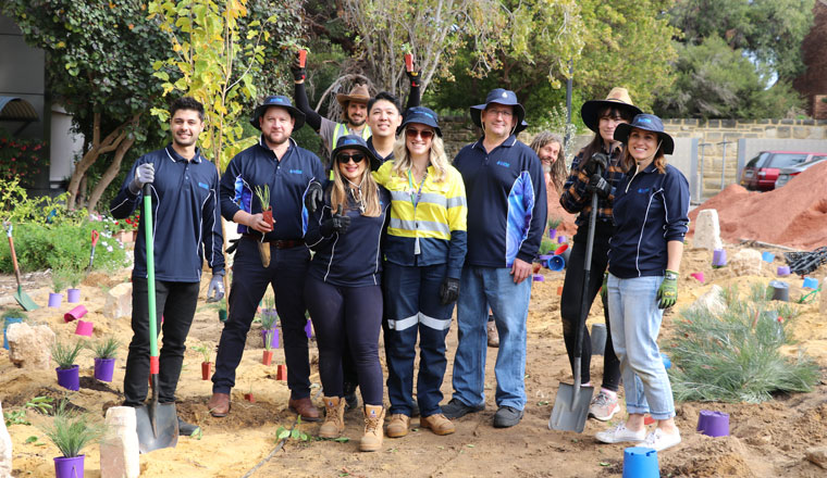 Sarah and her colleagues transforming the gardens of a public housing complex in Mosman Park